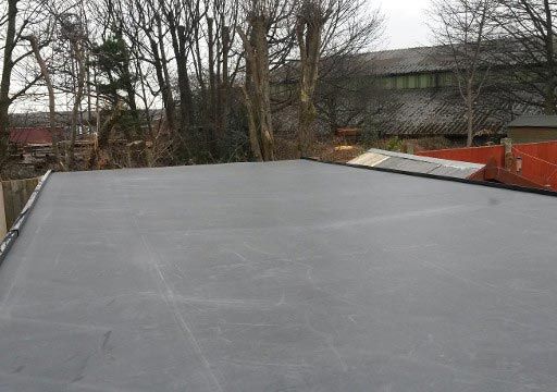 A flat rubber roof that has been installed by our team