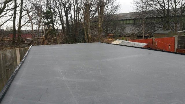 A flat rubber roof that has been installed by our team