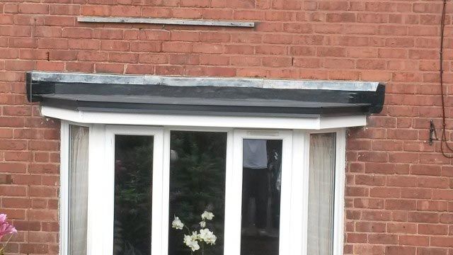 A rubber roof installed above a bay window